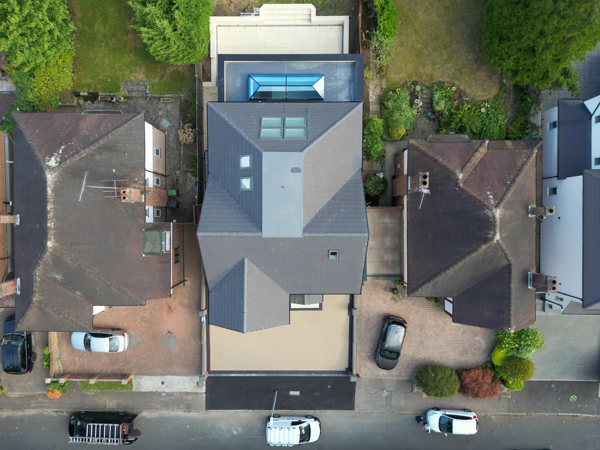 Aerial view of the completed Chigwell new build and its plot.