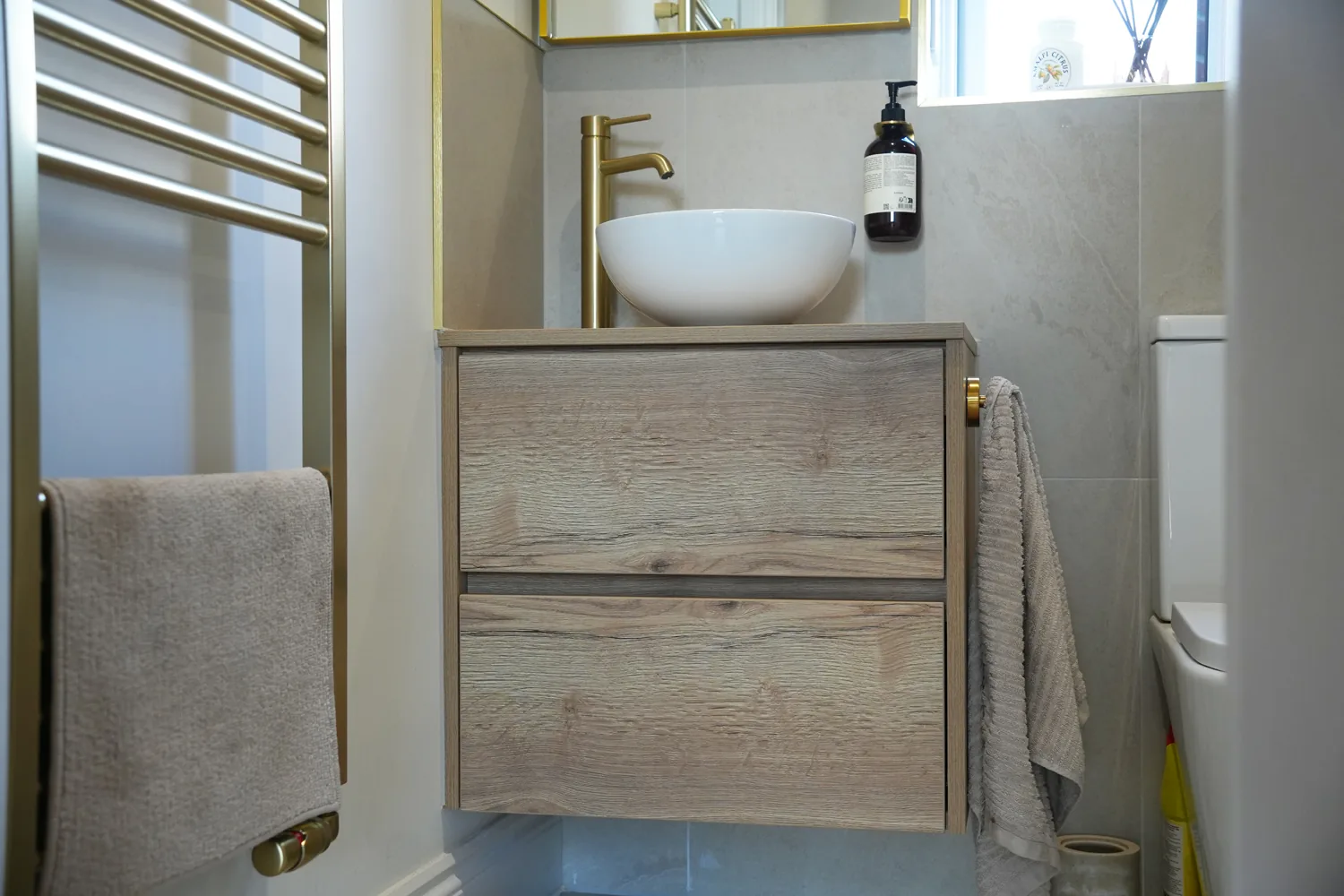Ground floor shower room in the Billericay side extension with brass fittings and bowl basin
