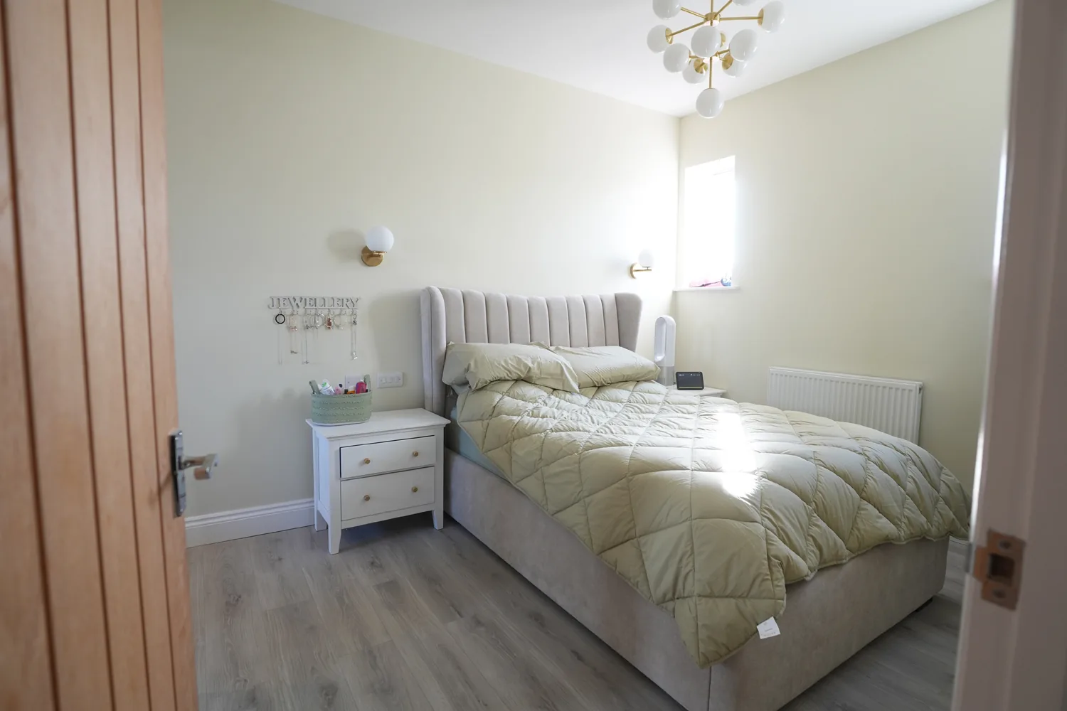 Bedroom on the extended upper floor of the Brentwood house with full height ceiling