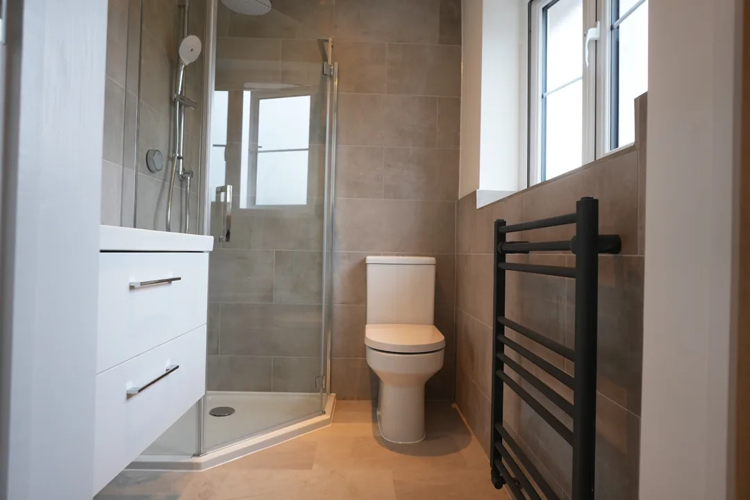New en suite shower room at the Cold Norton house with black towel radiator