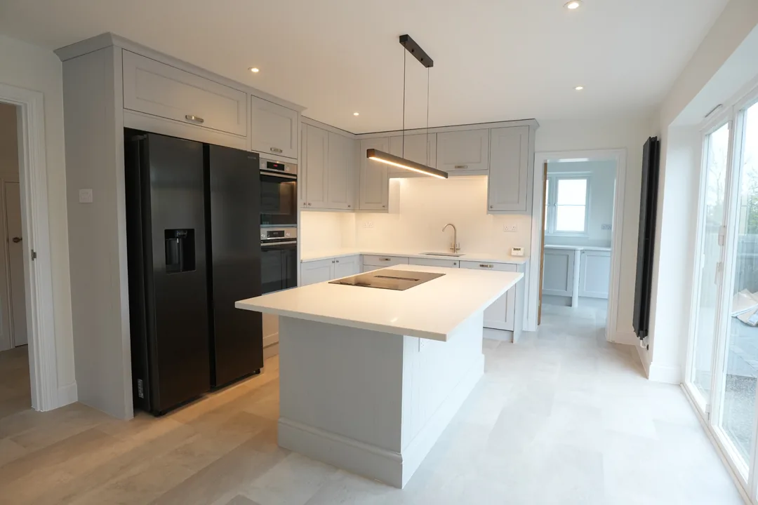 The new kitchen at the Cold Norton house with stone worktops and central island.