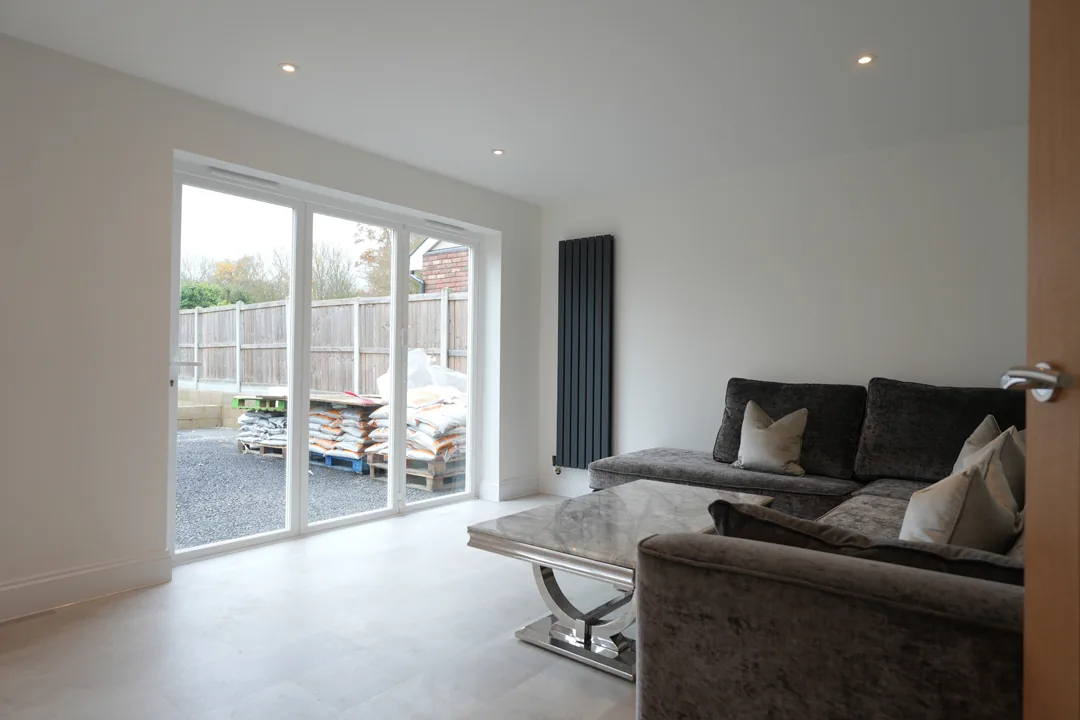 Open plan living space at the rear of the Cold Norton house with new sliding doors onto the garden