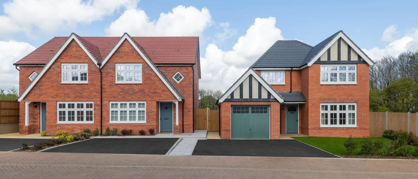 Semi-detached and detached Redrow homes on a new street at Hazel Park, Stevenage