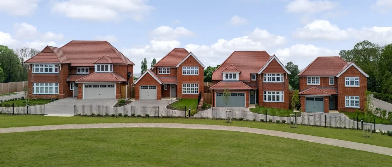 Row of Heritage Collection homes overlooking open green space at Hendricks Green, Goffs Oak
