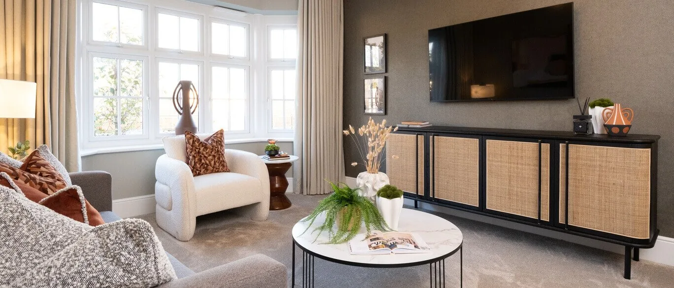 Finished show home lounge with media unit and bay window at Millview Park, Bocking