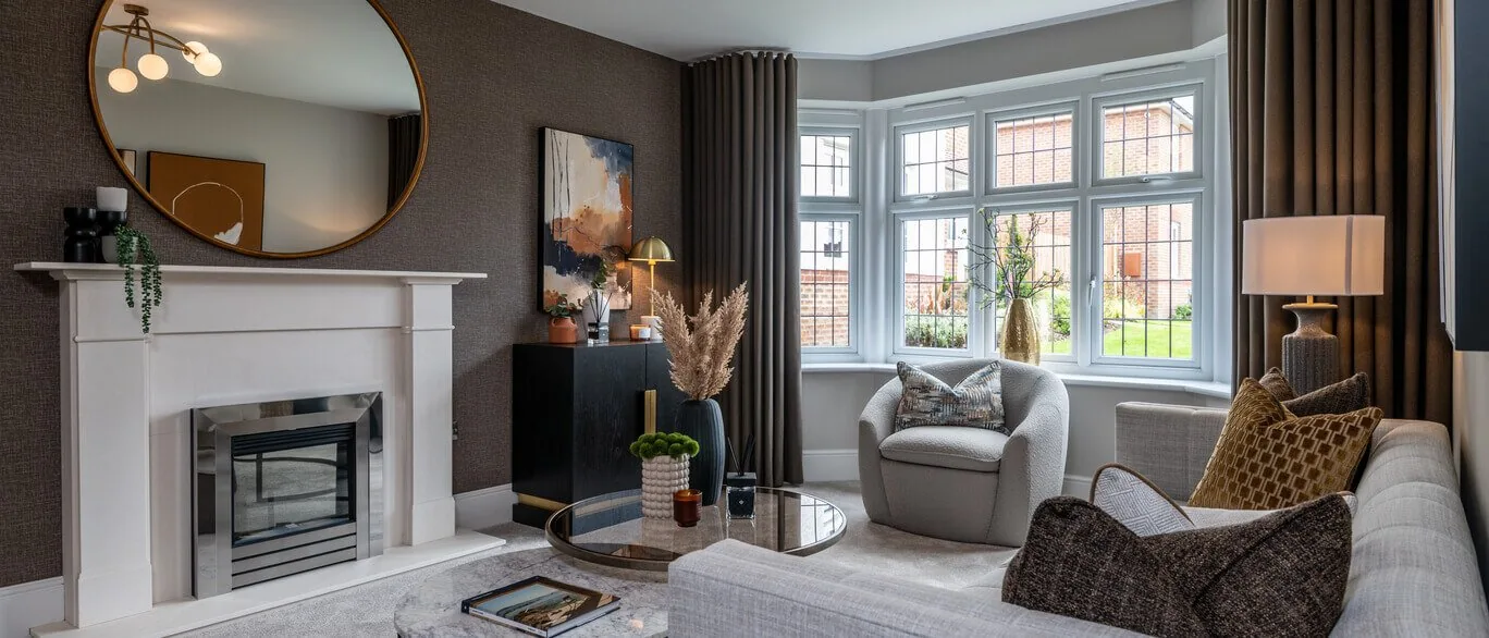 Finished show home lounge with fireplace and bay window at The Mulberries, Witham
