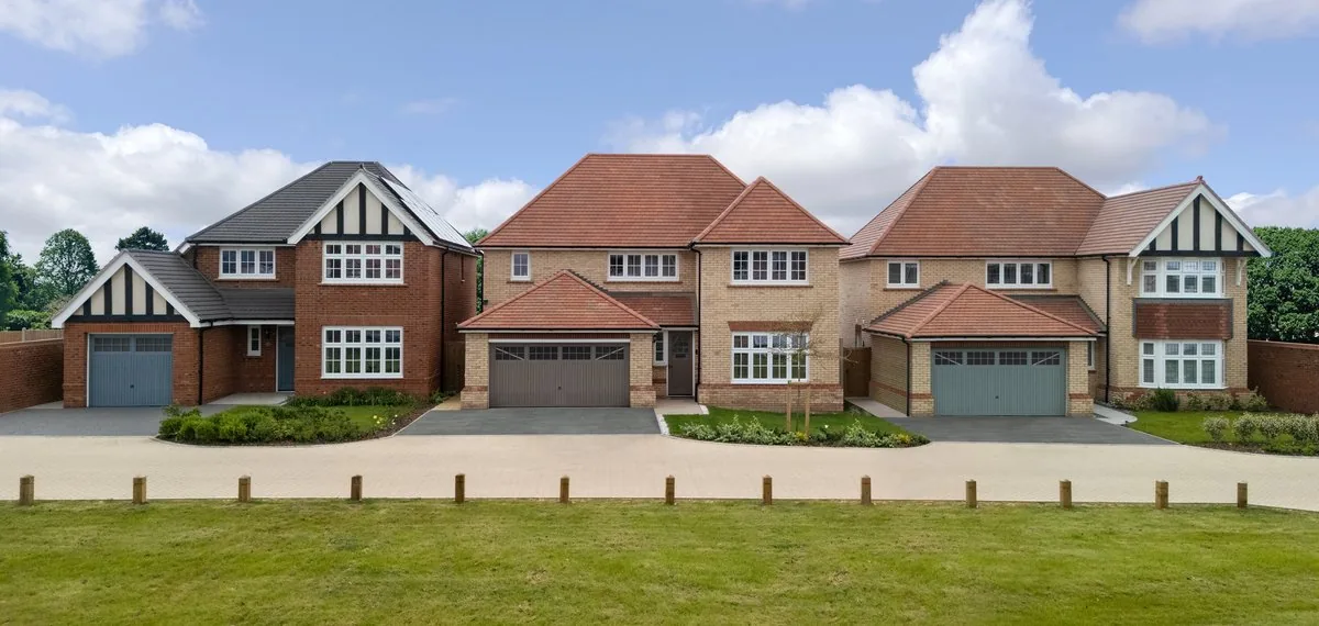Three detached Redrow homes facing open green space at The Mulberries, Witham