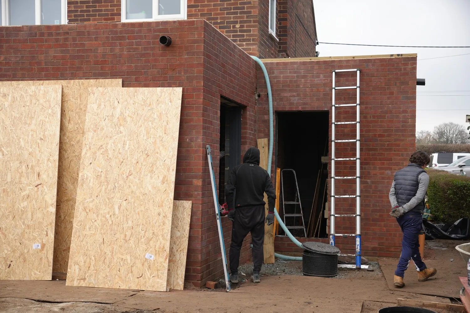 Door and window openings formed in the new brickwork of the Billericay extension mid-build.