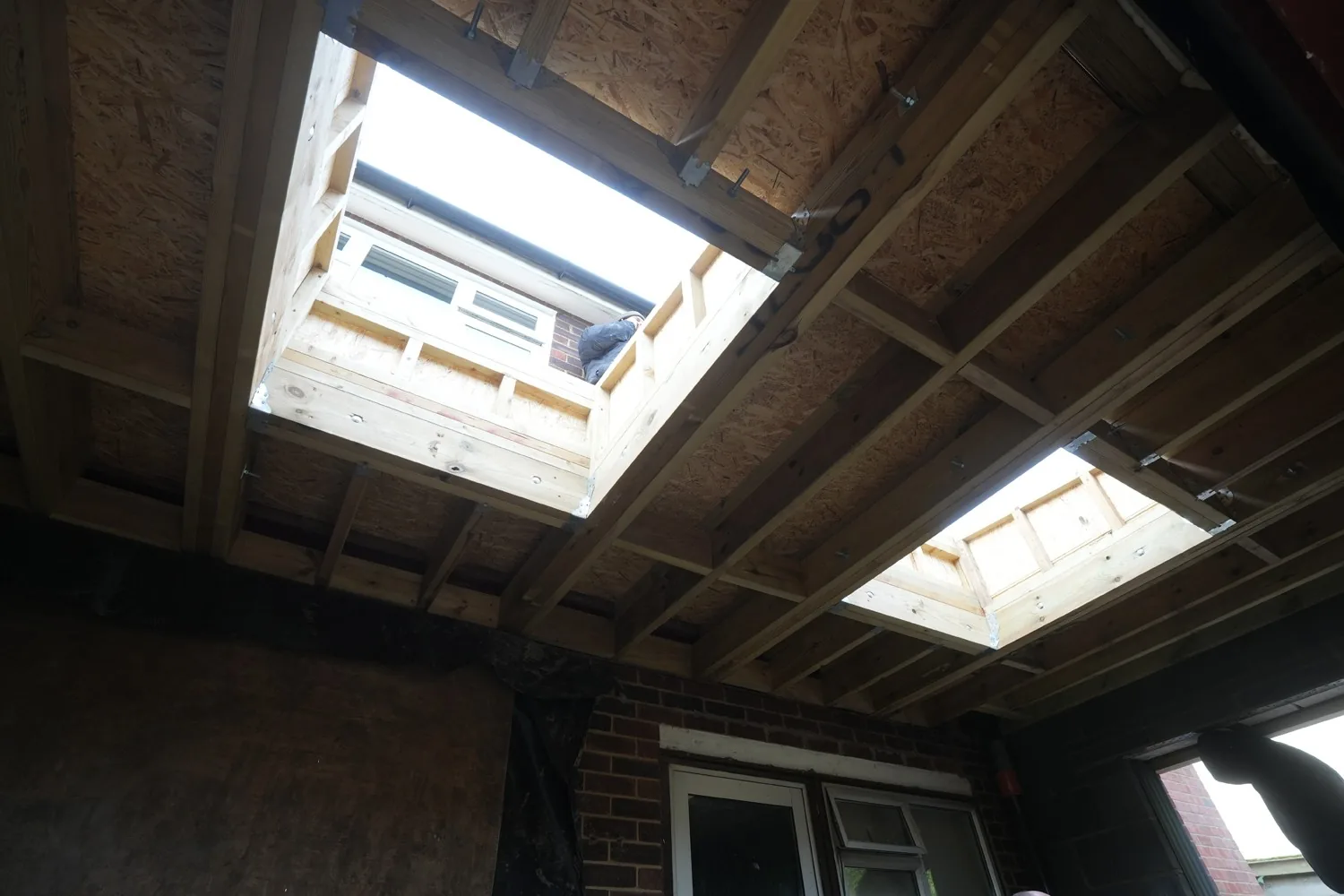 Two skylight openings framed in the new extension roof at Billericay, seen from inside.