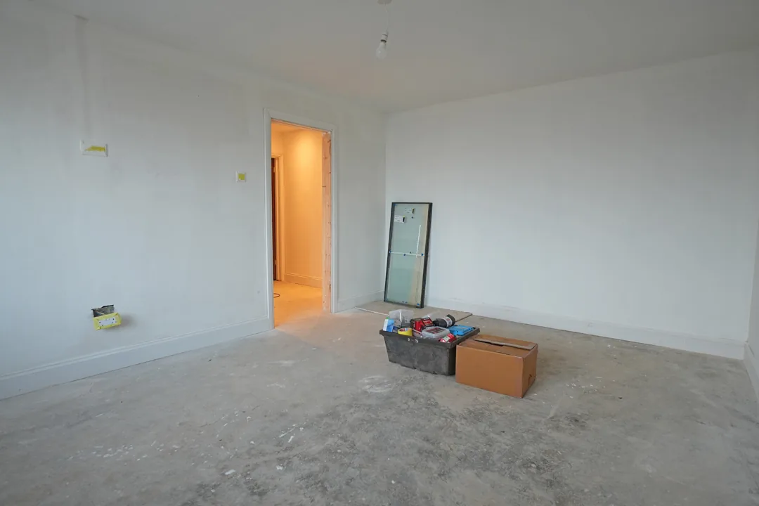 A bedroom skimmed and mist coated, back to clean, square surfaces before final decoration.