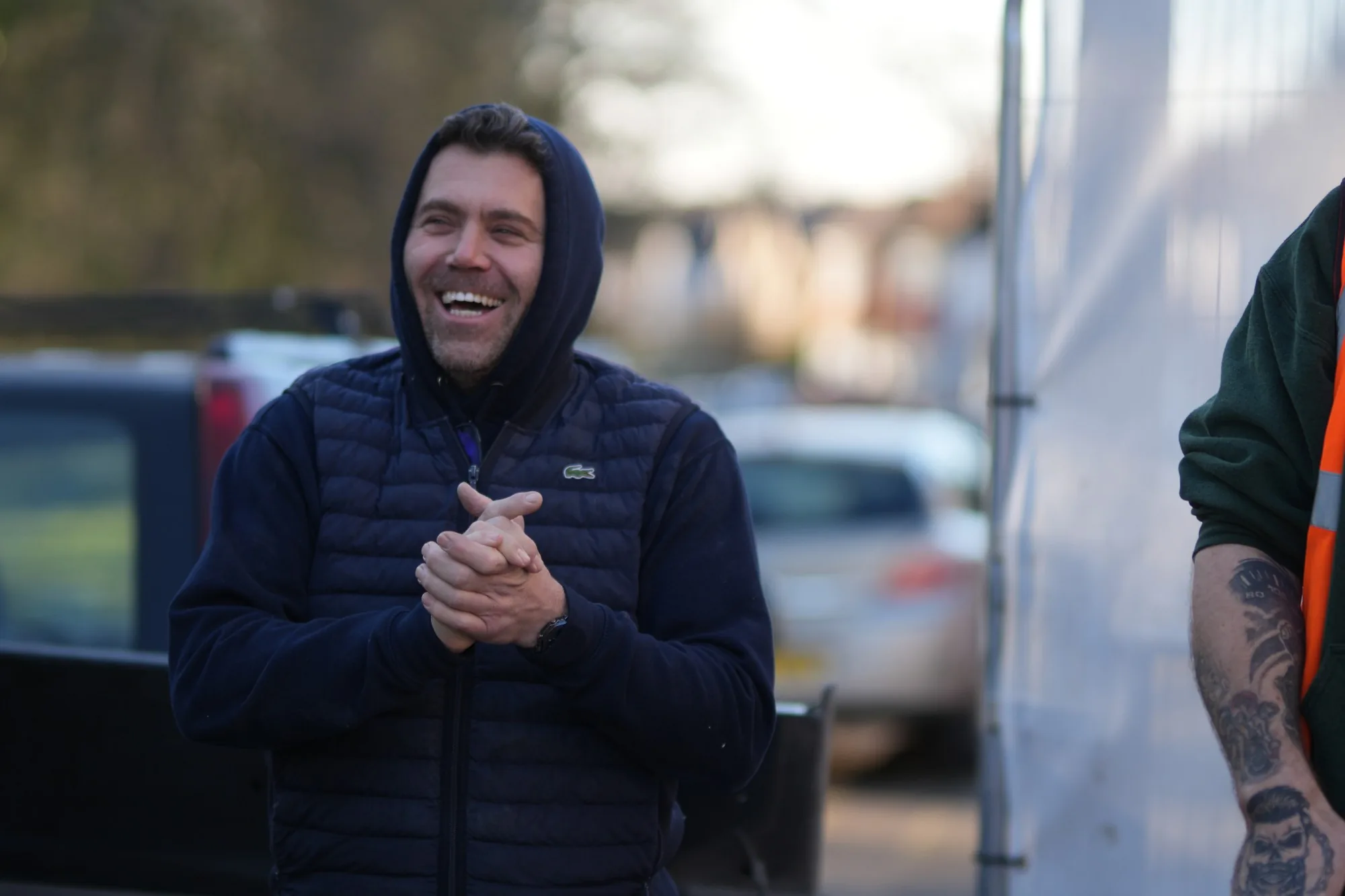 Craig Bellamy, founder of Madisons Commercial Solutions, laughing on site in navy work clothing