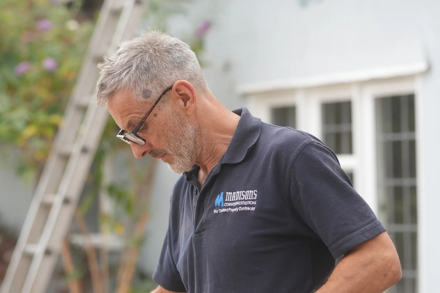 A Madisons operative in the company polo shirt at work on site at Heathcote Prep School, Danbury.